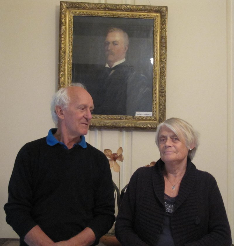 Sandys and Lesley Dawes, sit beneath a picture of 'Sir Edwyn' Sandys and Lesley Dawes, sit beneath a picture of 'Sir Edwyn'